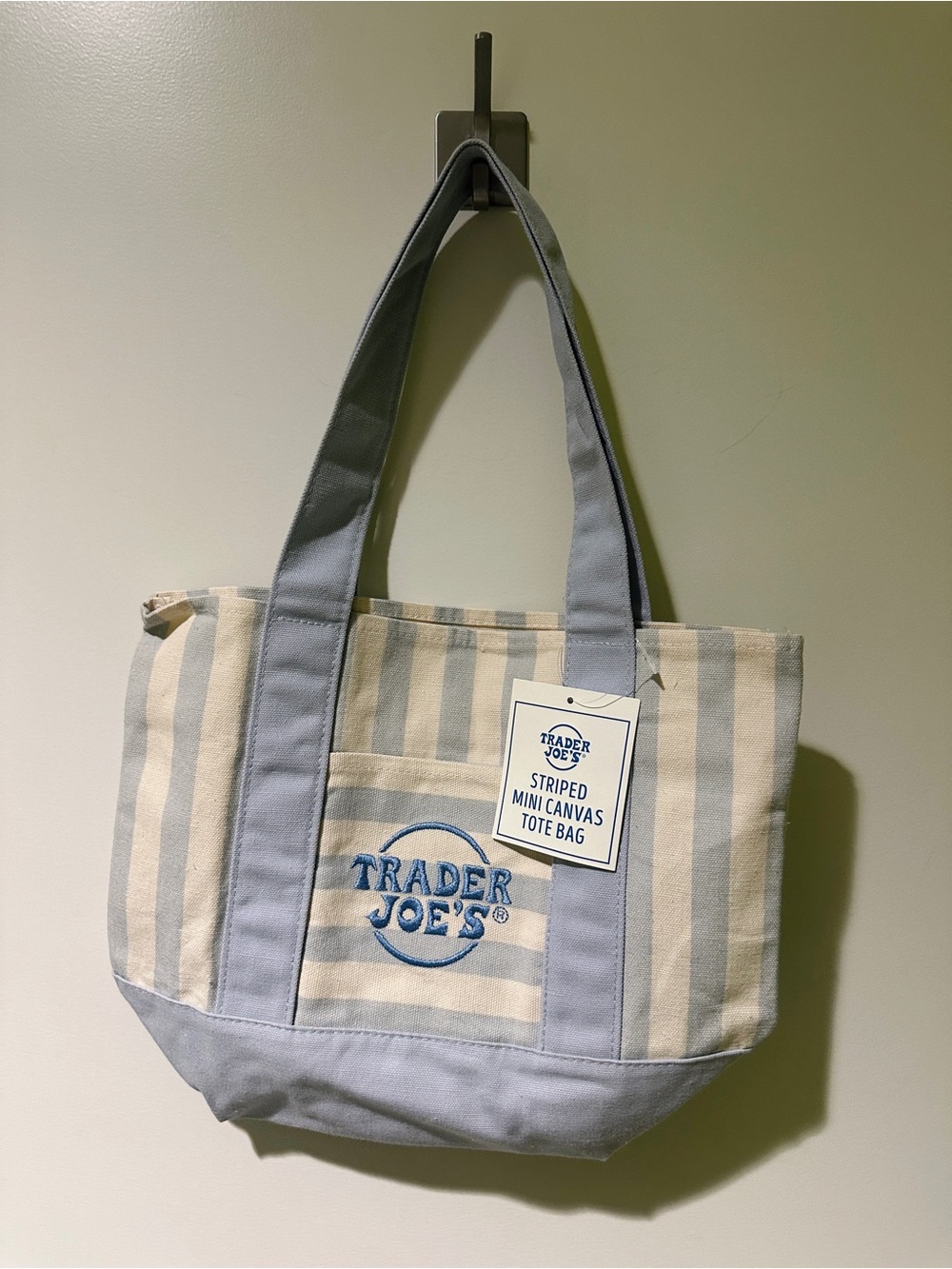 2 Trader Joe’s striped mini totes 
1 blue 1 pink 
Both NWT